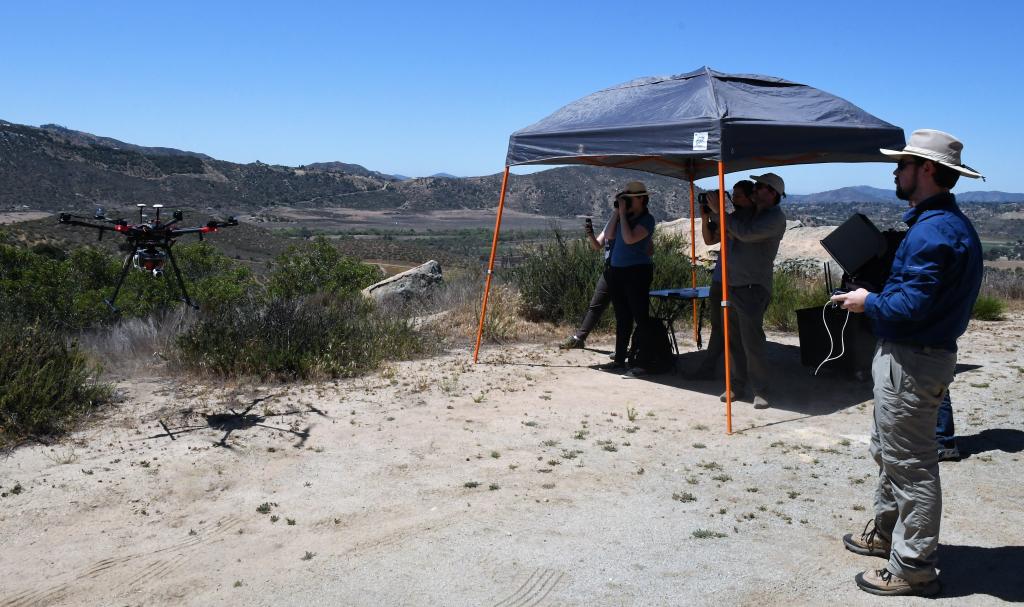 The team using the drone to survey and map the Biodiversity Reserve.